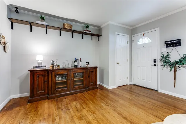 a bedroom with a bed and a potted plant