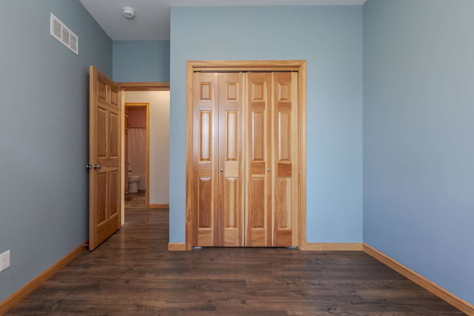 22037 East 2600 N Road Odell, IL 60460 - Photo 31 of 59 an empty room with wooden floor and a window