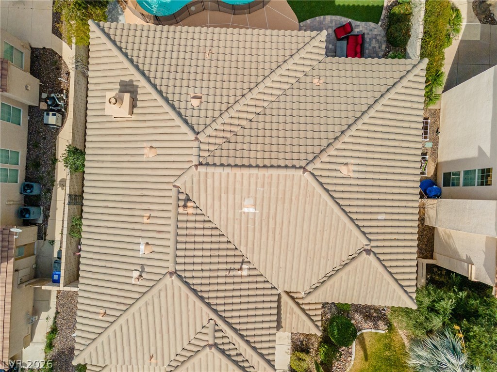 2504 Putting Green Drive Henderson, NV 89074 - Photo 50 of 56 An overhead view reveals a well-maintained tile roof and an inviting outdoor living space.