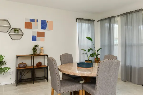 a view of a workspace with furniture and a potted plant