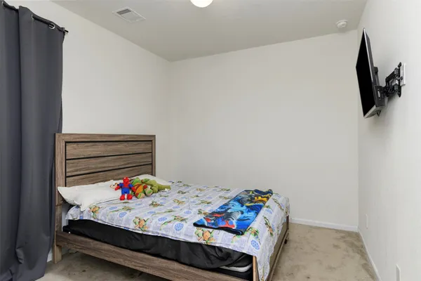 a bed room with a bed and a couch