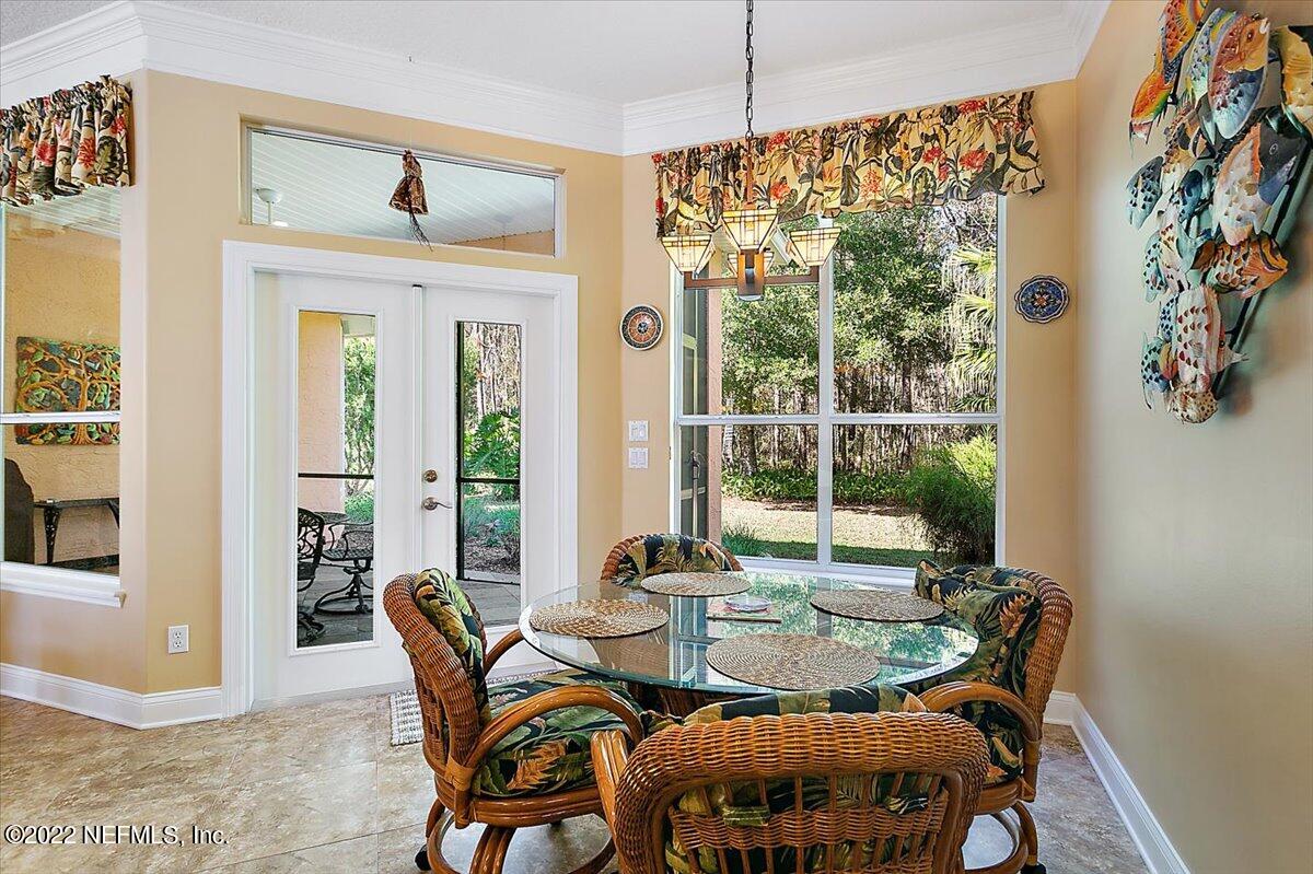 184 Edge Of Woods Road St. Augustine, FL 32092 - Photo 11 of 24 a view of a dining room with furniture window and outside view