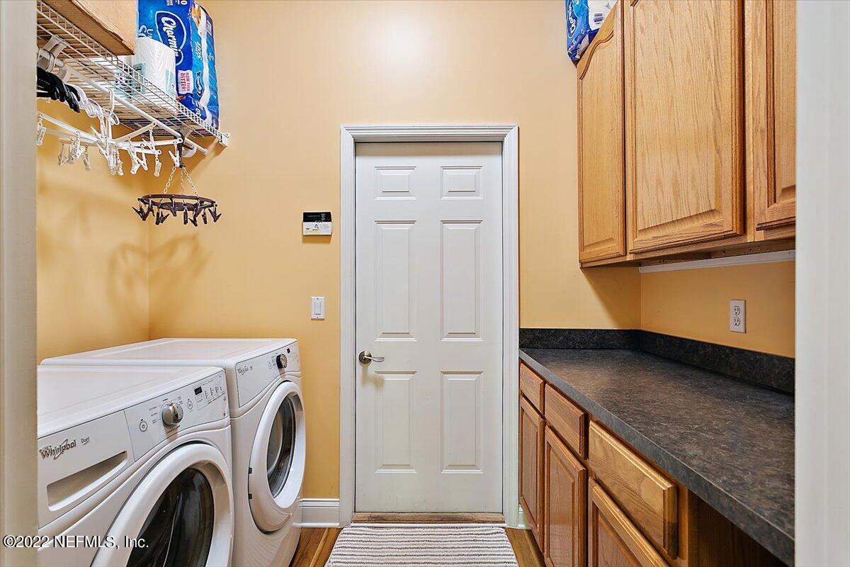 184 Edge Of Woods Road St. Augustine, FL 32092 - Photo 18 of 24 a utility room with dryer and washer