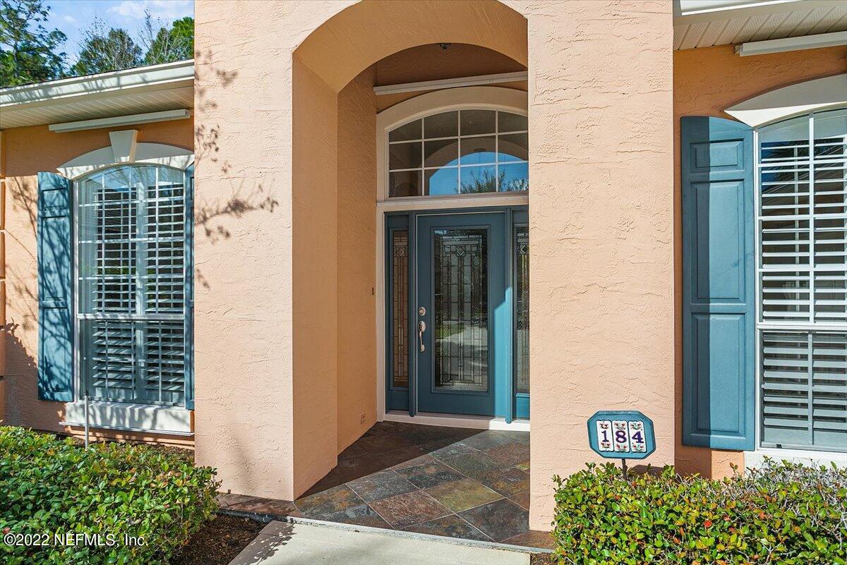 184 Edge Of Woods Road St. Augustine, FL 32092 - Photo 2 of 24 a front view of a house with a yard