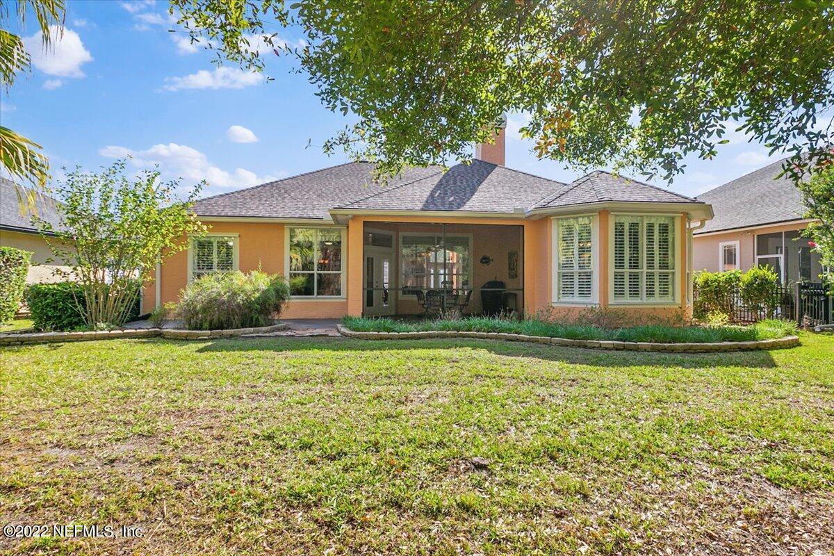 184 Edge Of Woods Road St. Augustine, FL 32092 - Photo 21 of 24 a front view of a house with a yard