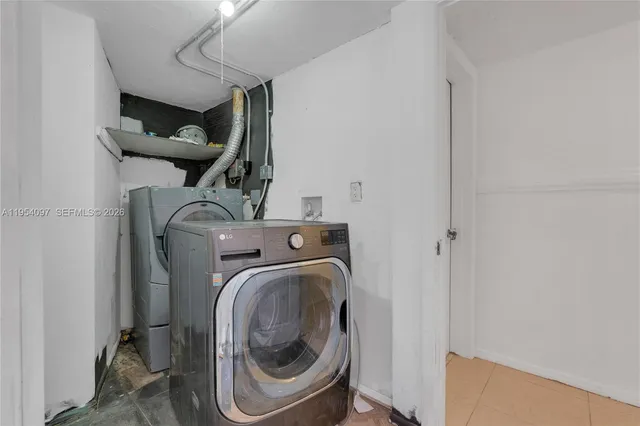 a utility room with dryer and washer