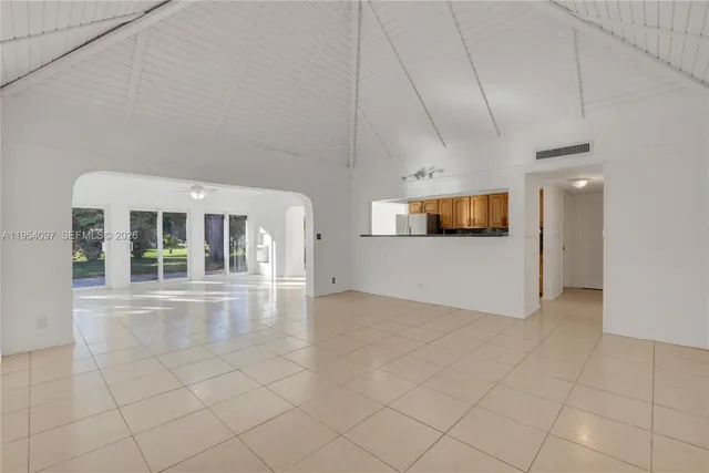 a view of a living room with a fireplace
