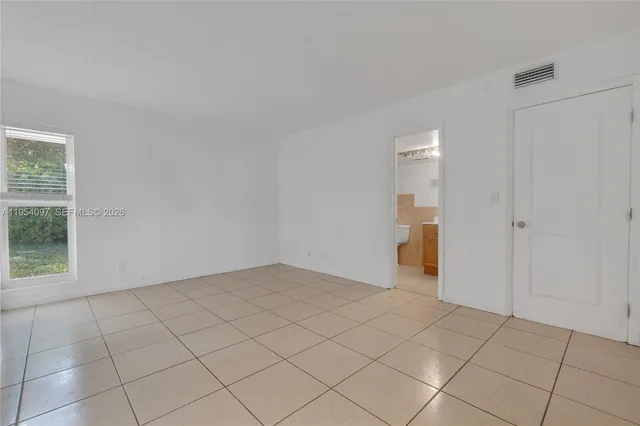 a view of an empty room and window