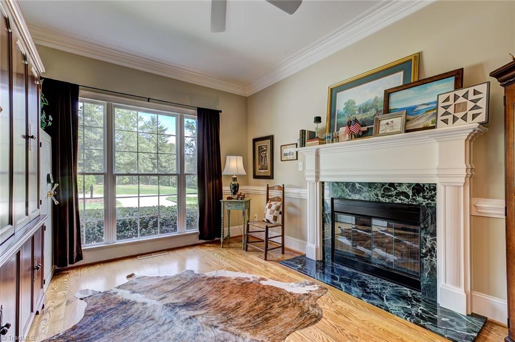122 Augusta Place High Point, NC 27265 - Photo 11 of 30 The private main level office receives wonderful light and features a second fireplace with marble accent and mantel with heavy molding detail.