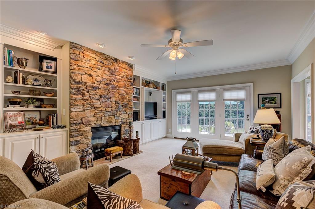 122 Augusta Place High Point, NC 27265 - Photo 5 of 30 The spacious living room is a wonderful place to relax after a long day or gather for informal occasions. The stacked stone fireplace offers elegant warmth.