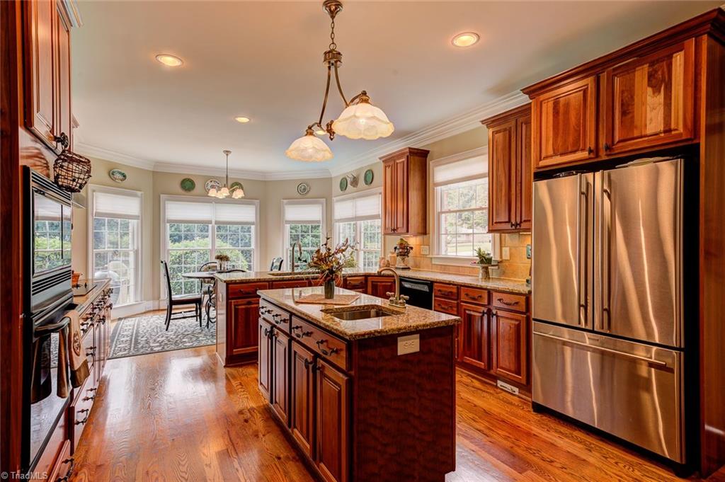 122 Augusta Place High Point, NC 27265 - Photo 10 of 30 The built-in oven and island with prep sink make cooking a pleasure!