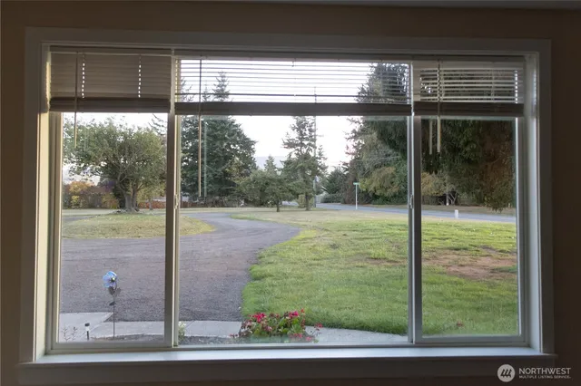 a view of a glass door and a yard