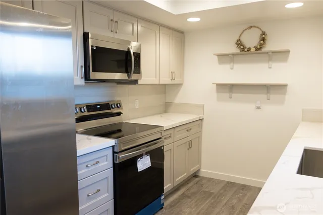 a kitchen with a stove and a microwave