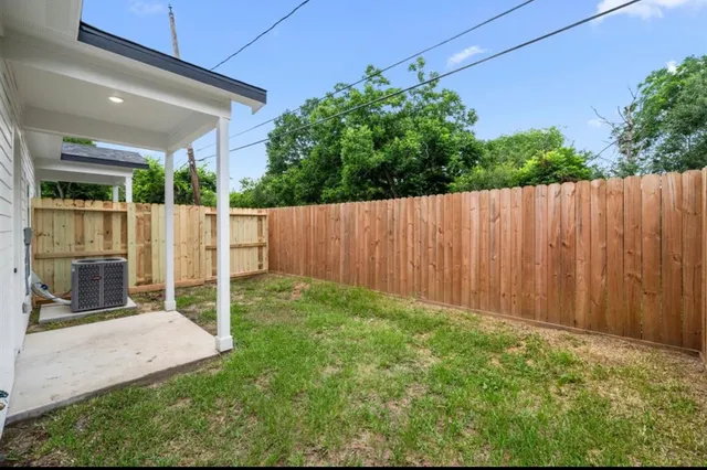 a view of backyard with green space