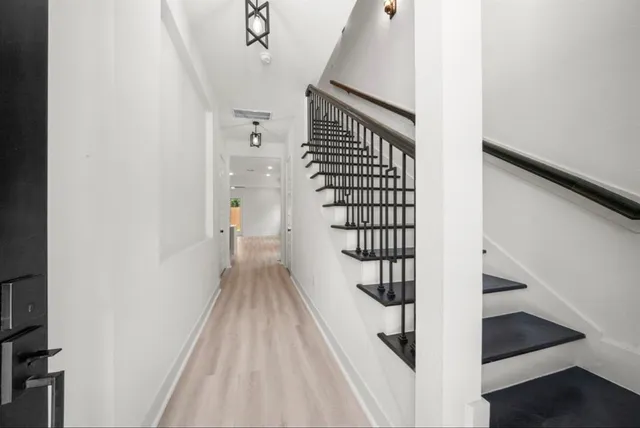 a view of entryway with wooden floor