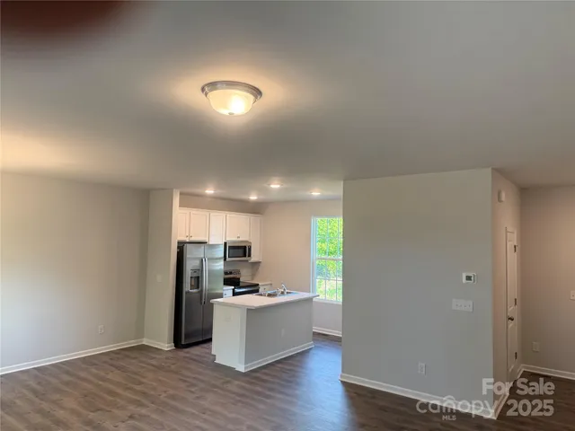 a view of kitchen with wooden floor
