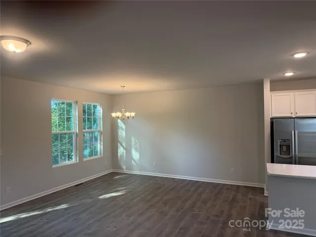 an empty room with wooden floor