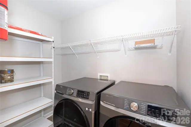 a utility room with dryer and washer