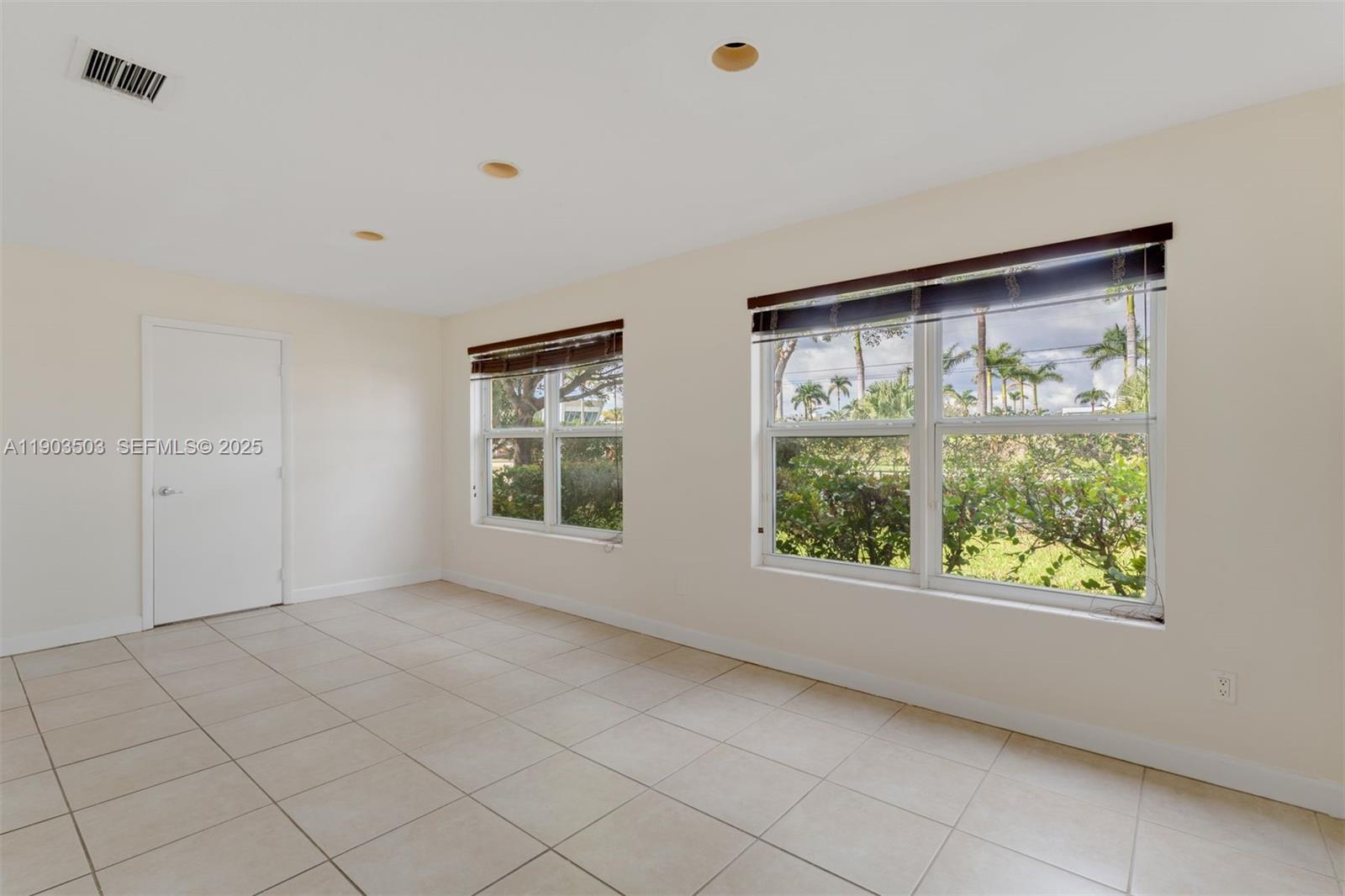 8670 Southwest 27th Lane Miami, FL 33155 - Photo 11 of 31 a view of an empty room with a window