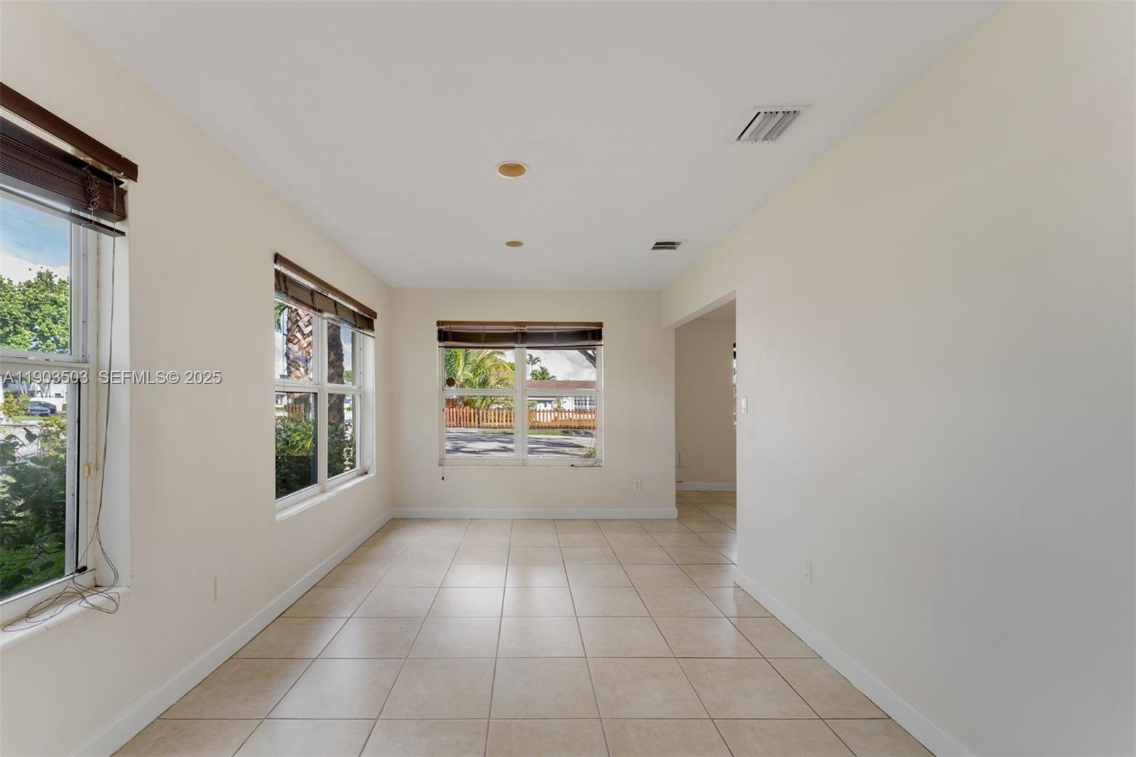 8670 Southwest 27th Lane Miami, FL 33155 - Photo 12 of 31 a view of an empty room with a window