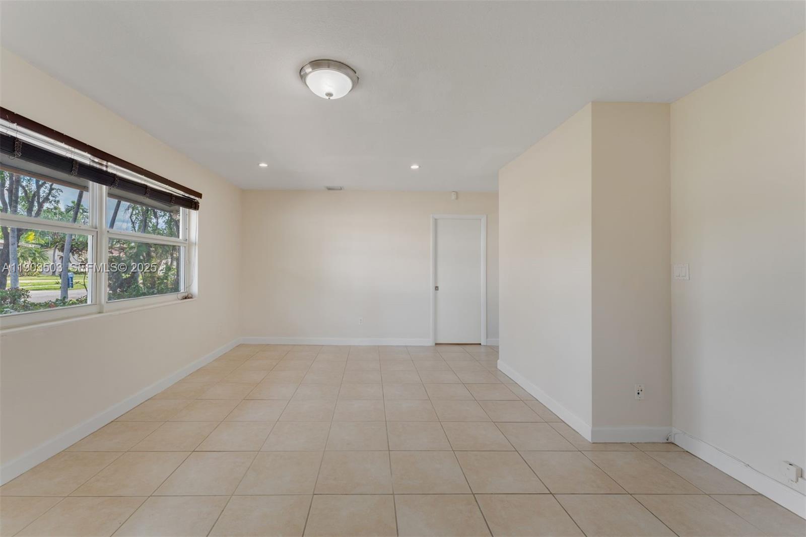 8670 Southwest 27th Lane Miami, FL 33155 - Photo 17 of 31 an empty room with windows