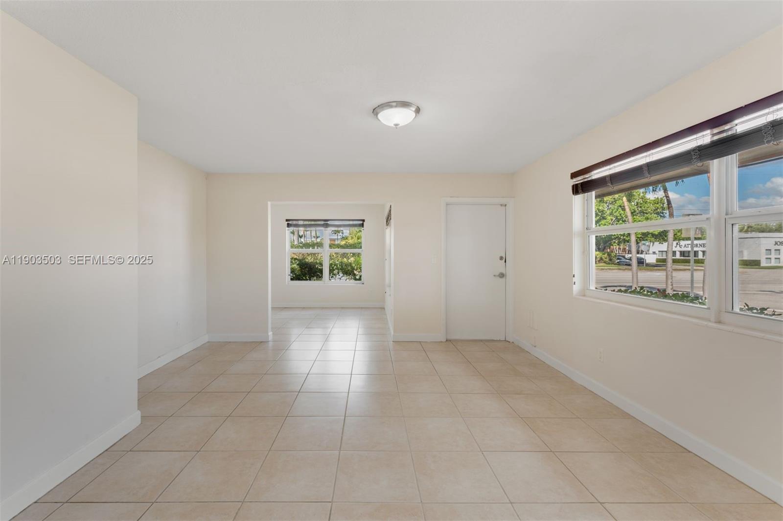 8670 Southwest 27th Lane Miami, FL 33155 - Photo 18 of 31 a view of an empty room with a window