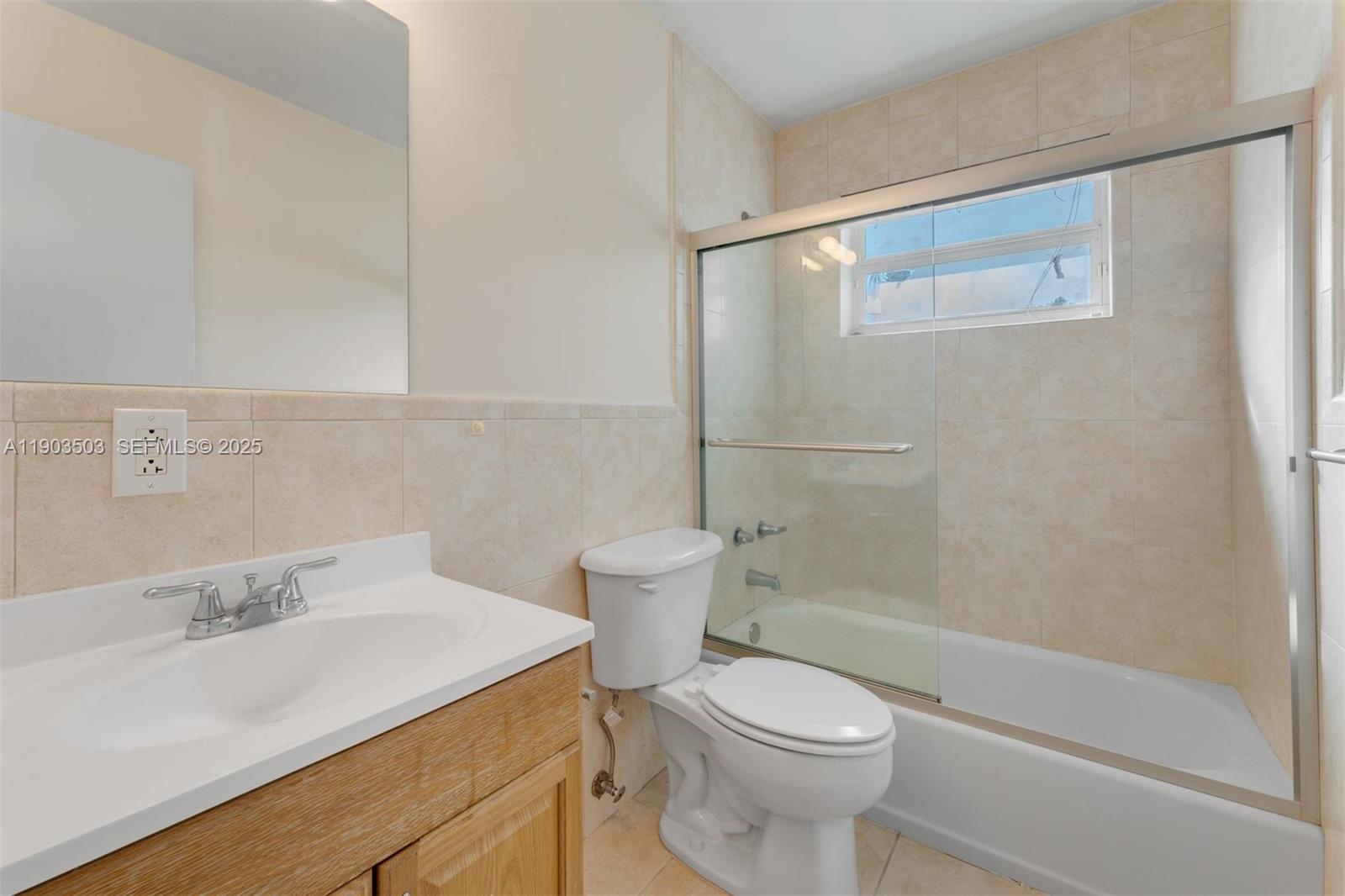 8670 Southwest 27th Lane Miami, FL 33155 - Photo 22 of 31 a bathroom with a sink a toilet and shower