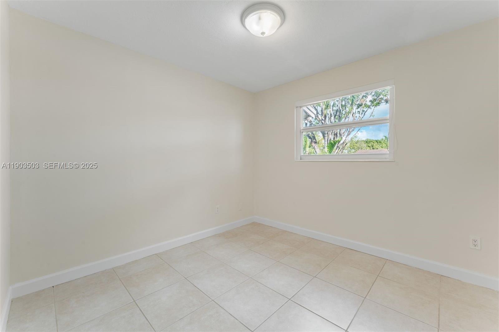 8670 Southwest 27th Lane Miami, FL 33155 - Photo 23 of 31 an empty room with windows