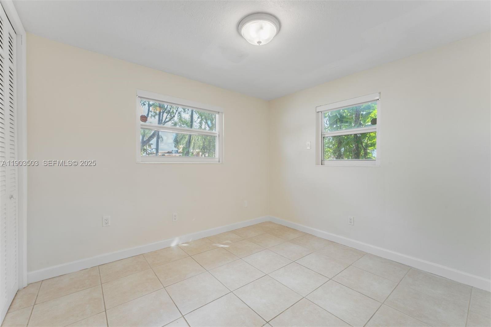8670 Southwest 27th Lane Miami, FL 33155 - Photo 24 of 31 an empty room with a window