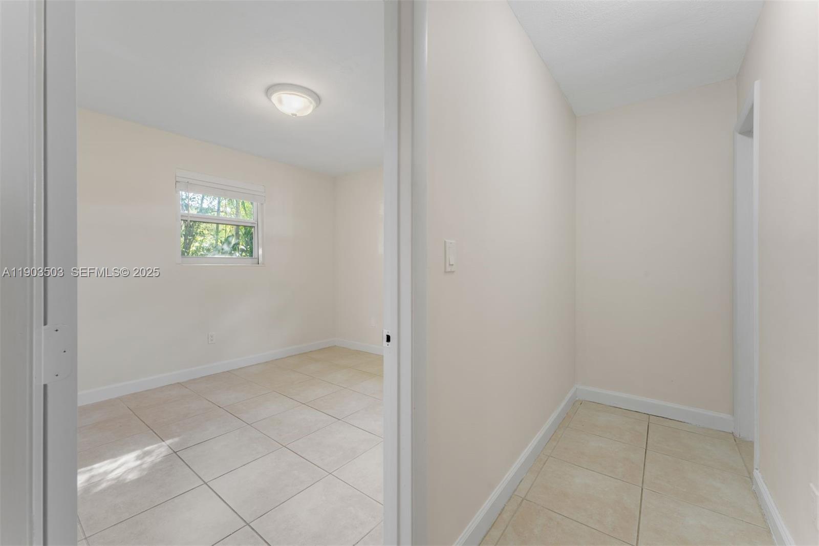 8670 Southwest 27th Lane Miami, FL 33155 - Photo 25 of 31 an empty room with windows