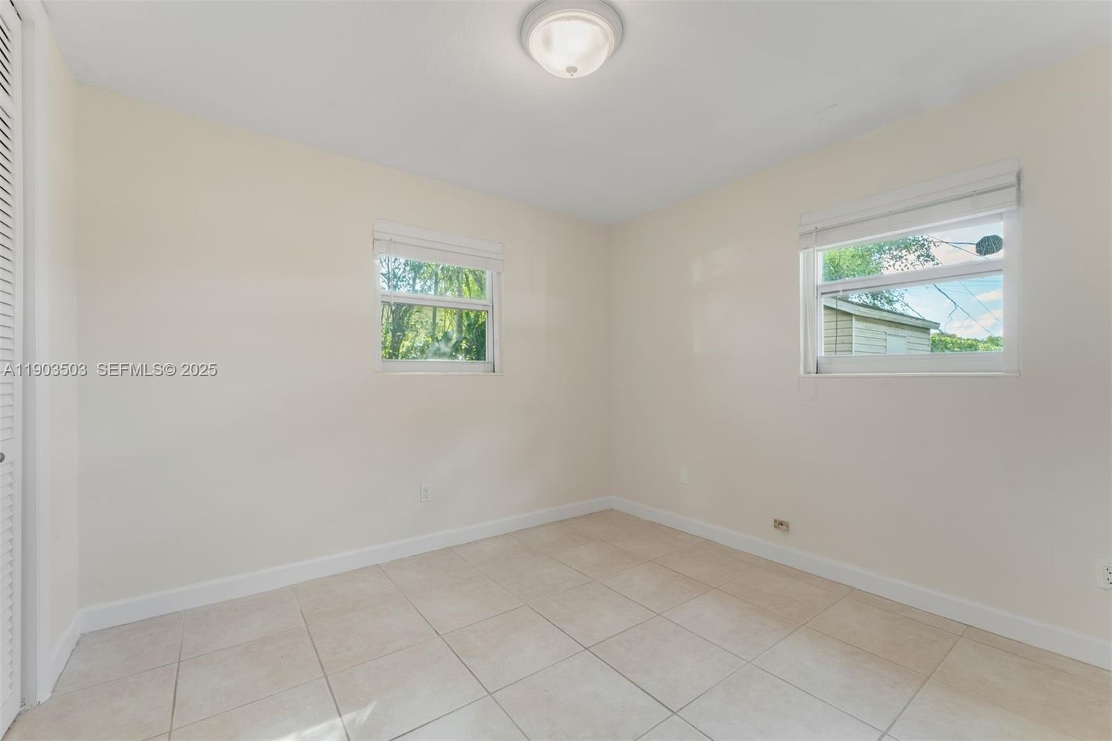 8670 Southwest 27th Lane Miami, FL 33155 - Photo 26 of 31 an empty room with windows