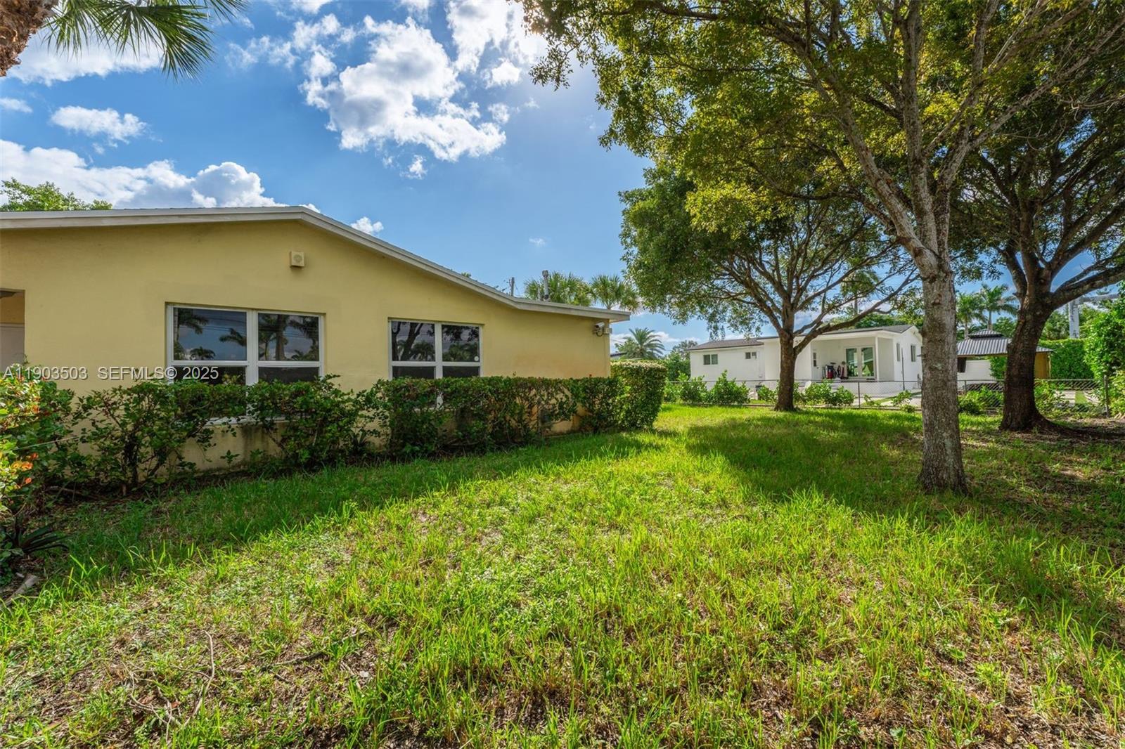 8670 Southwest 27th Lane Miami, FL 33155 - Photo 30 of 31 a house view with a garden space