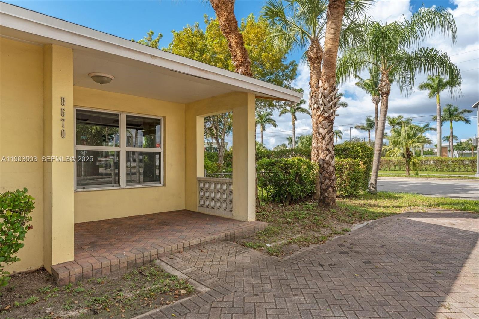 8670 Southwest 27th Lane Miami, FL 33155 - Photo 5 of 31 a view of a house with a yard