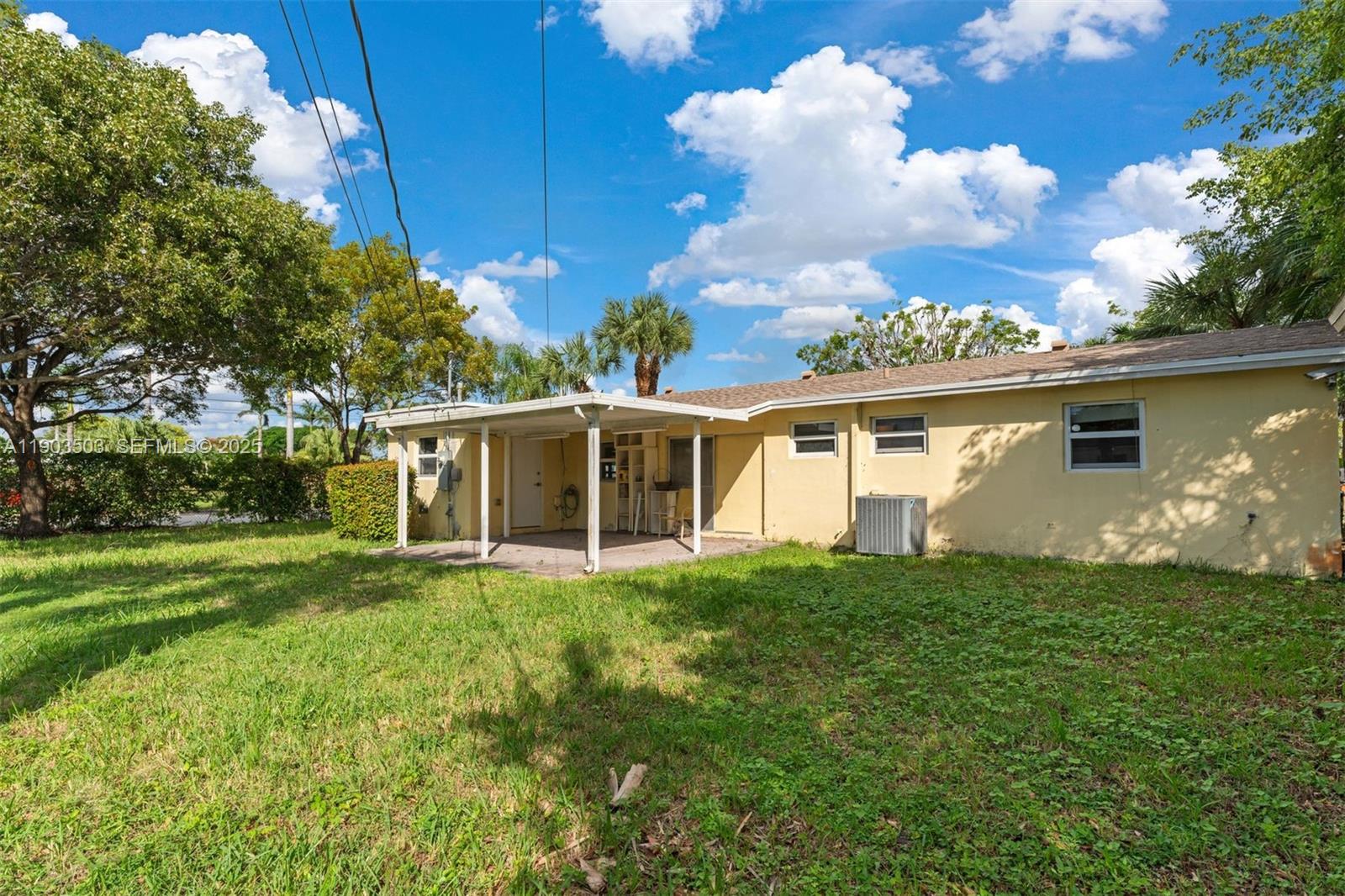 8670 Southwest 27th Lane Miami, FL 33155 - Photo 8 of 31 a view of a house with a yard