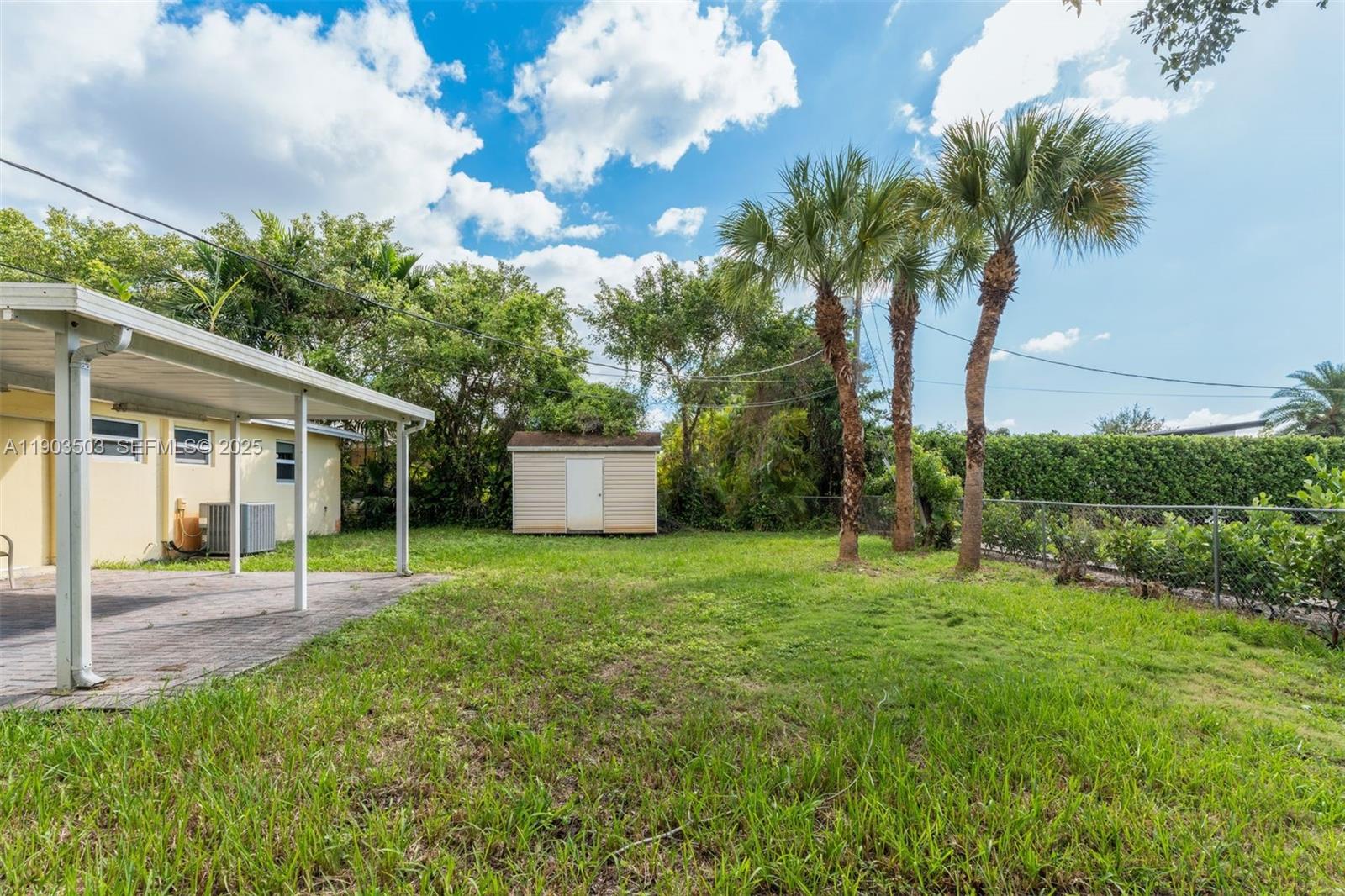 8670 Southwest 27th Lane Miami, FL 33155 - Photo 9 of 31 a view of a house with a backyard