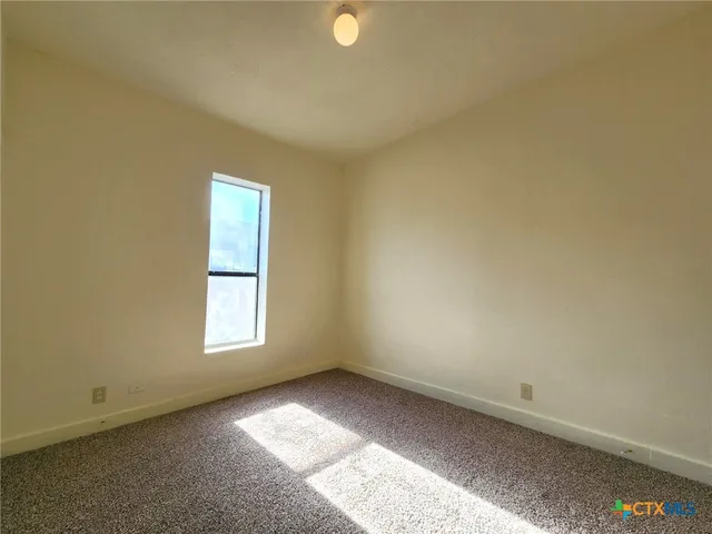 an empty room with a bench