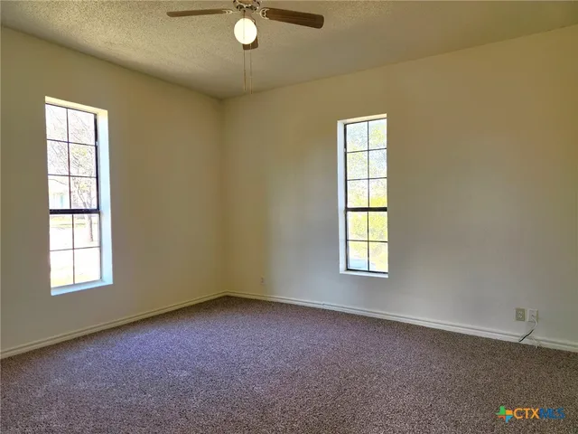 an empty room with windows
