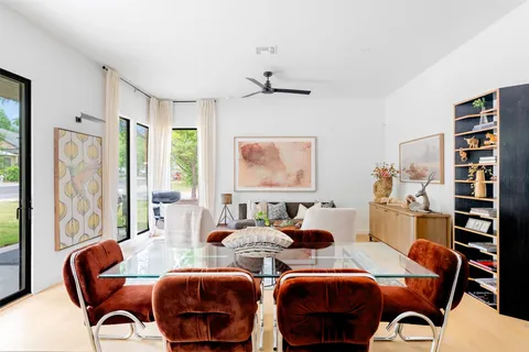 a view of a dining room with furniture window and outside view