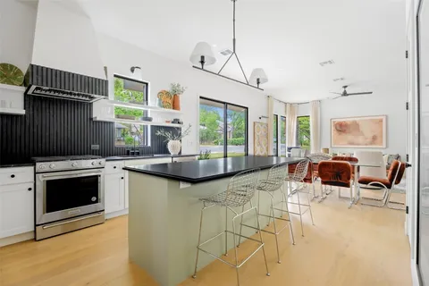 a view of a living room and kitchen