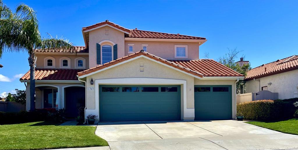 1363 Sparrow Road Carlsbad, CA 92011 - Photo 1 of 1 a front view of a house with a yard and garage