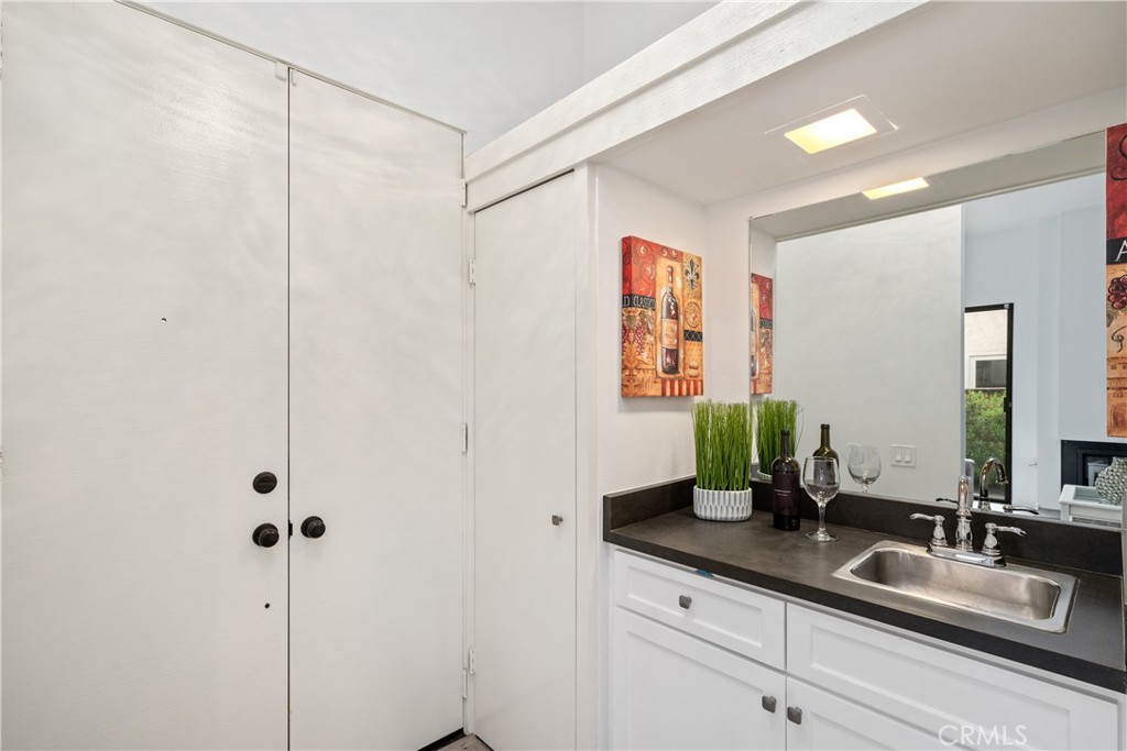 435 Fairview Avenue, Unit 7 Arcadia, CA 91007 - Photo 16 of 35 a bathroom with a double vanity sink and a mirror