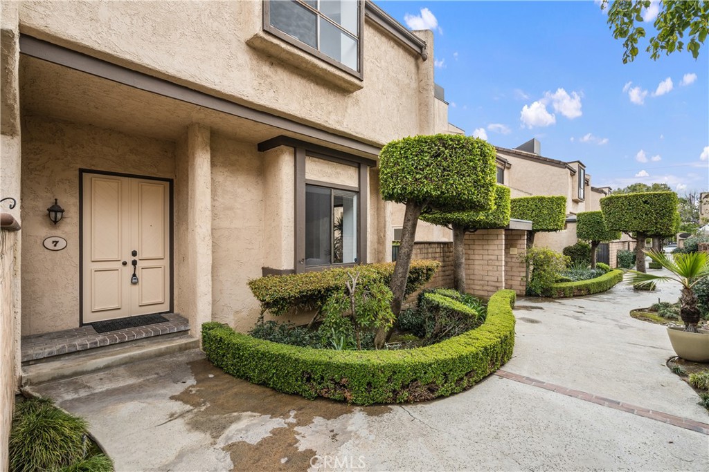 435 Fairview Avenue, Unit 7 Arcadia, CA 91007 - Photo 2 of 35 a front view of a house with garden