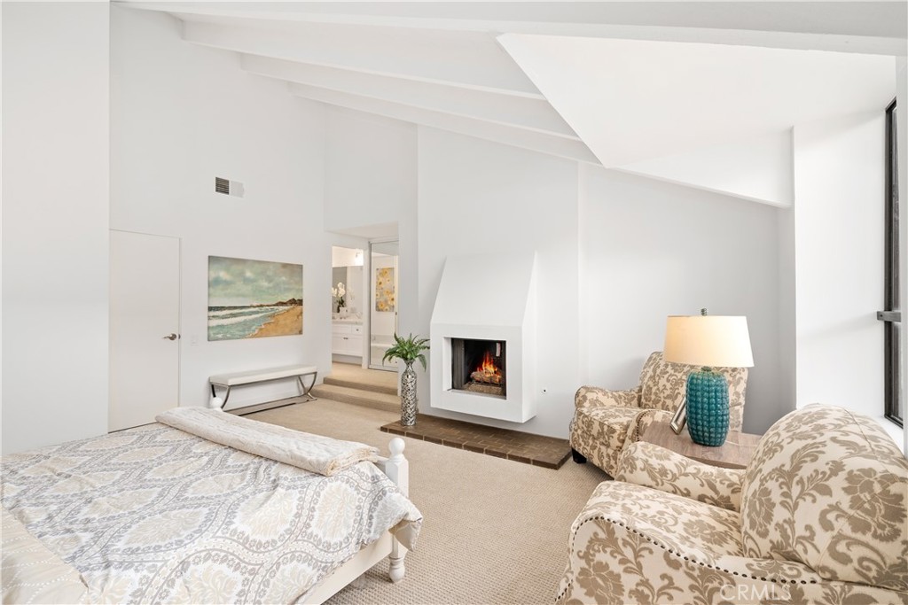 435 Fairview Avenue, Unit 7 Arcadia, CA 91007 - Photo 24 of 35 a bedroom with a bed and a fireplace