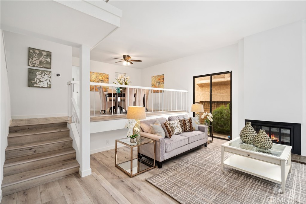 435 Fairview Avenue, Unit 7 Arcadia, CA 91007 - Photo 4 of 35 a living room with furniture and a painting