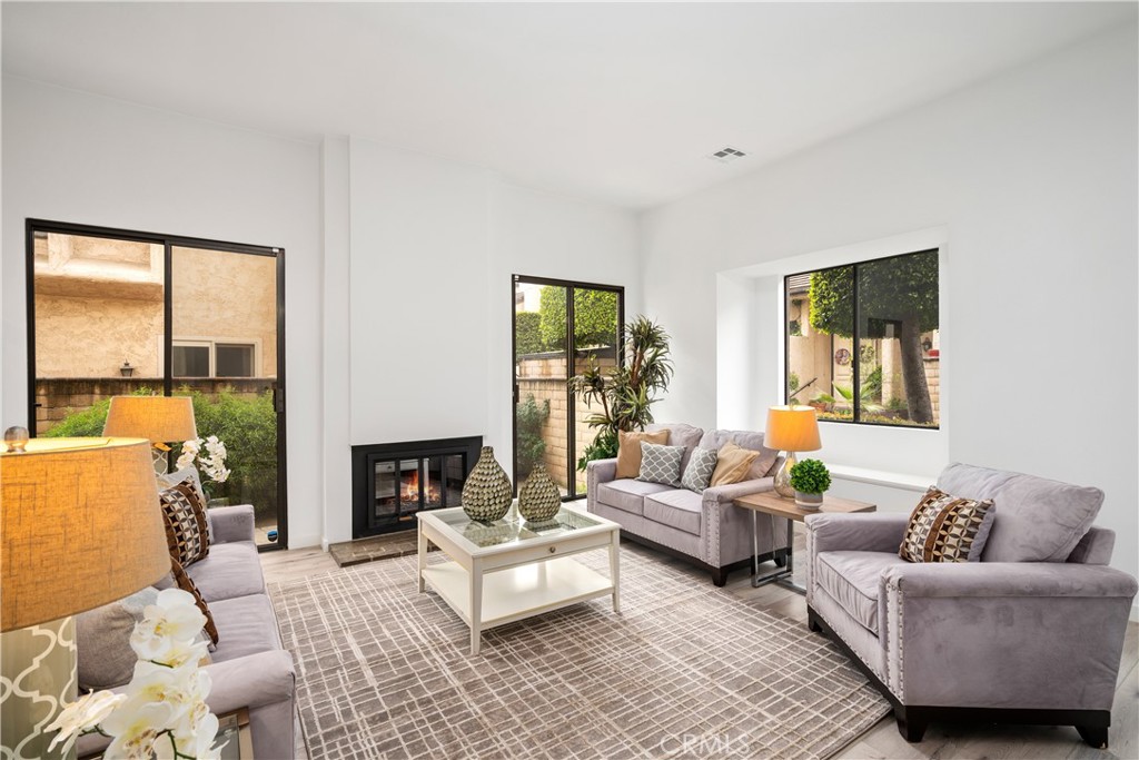 435 Fairview Avenue, Unit 7 Arcadia, CA 91007 - Photo 5 of 35 a living room with furniture and a fireplace