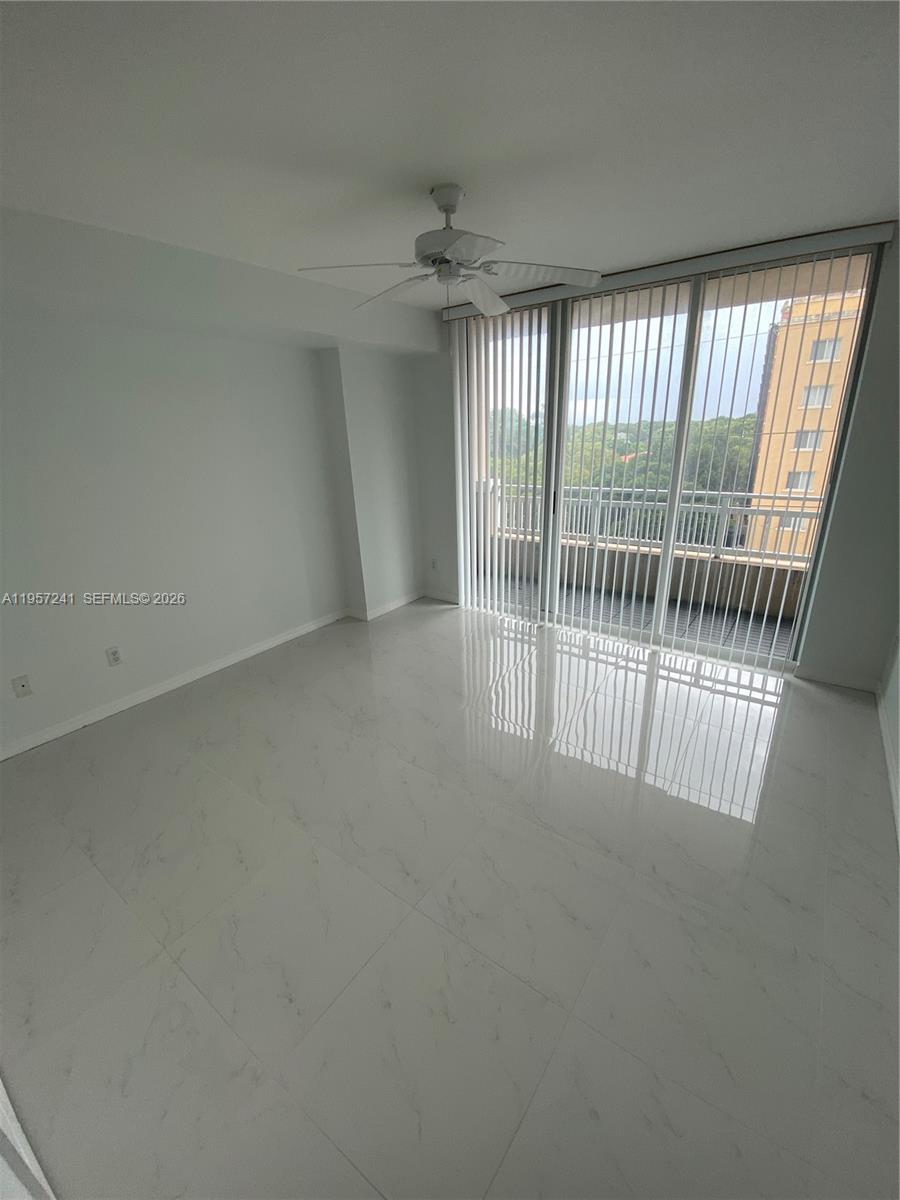 2665 Southwest 37th Avenue, Unit 508 Miami, FL 33133 - Photo 2 of 12 an empty room with windows