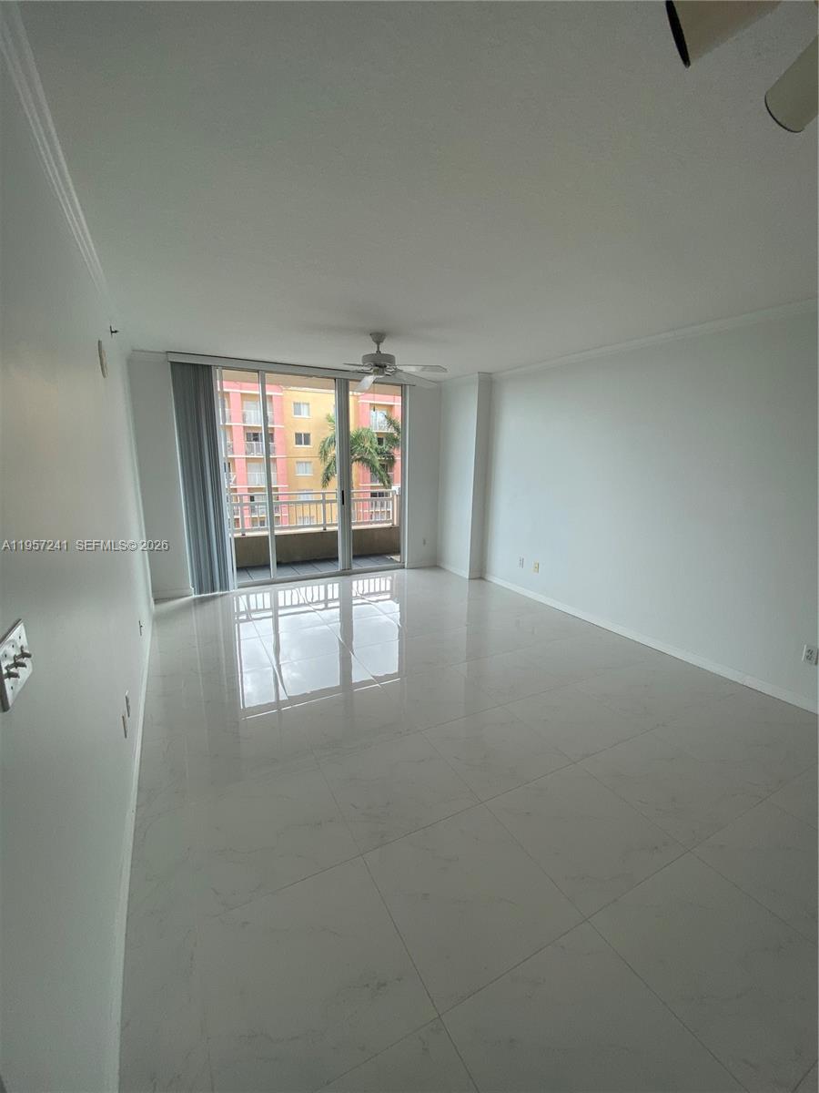 2665 Southwest 37th Avenue, Unit 508 Miami, FL 33133 - Photo 8 of 12 an empty room with windows and pillars in it
