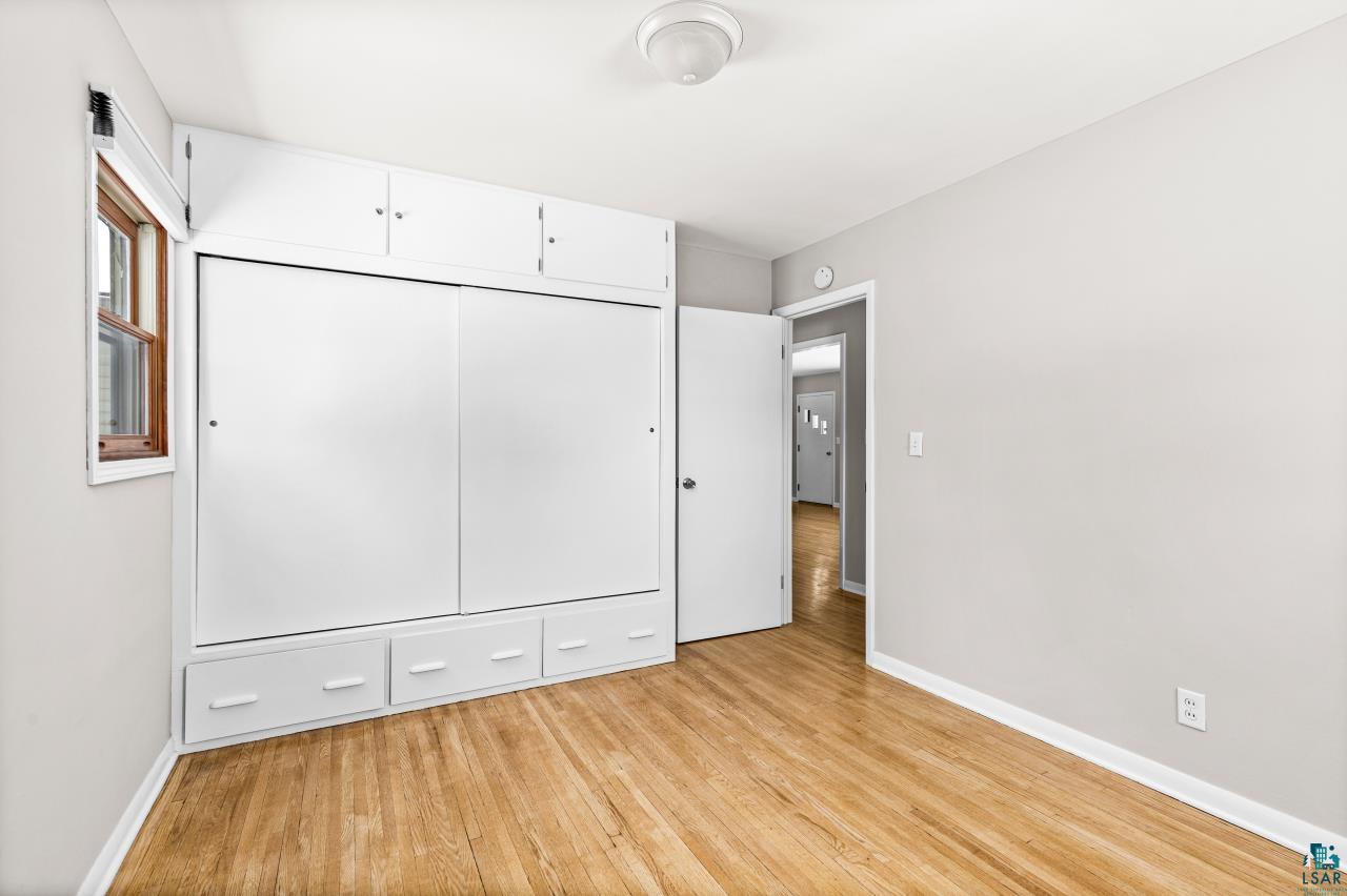 3754 Carlton Street Barnum, MN 55707 - Photo 23 of 52 Unfurnished bedroom featuring light wood-style flooring and a closet