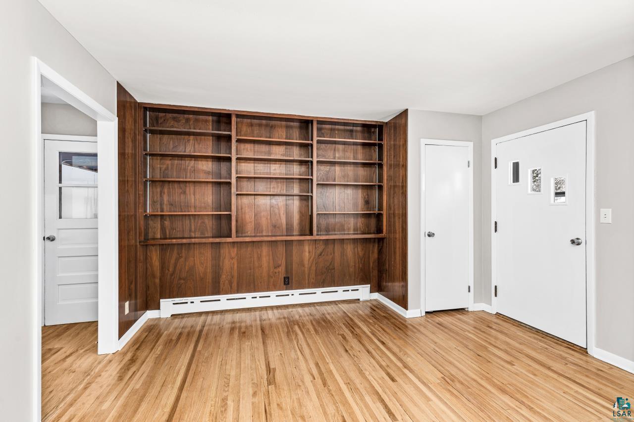 3754 Carlton Street Barnum, MN 55707 - Photo 24 of 52 Entrance foyer featuring a baseboard heating unit and light wood-type flooring