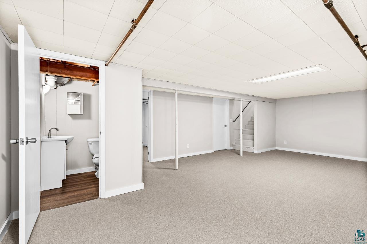 3754 Carlton Street Barnum, MN 55707 - Photo 43 of 52 Finished basement featuring carpet and baseboards